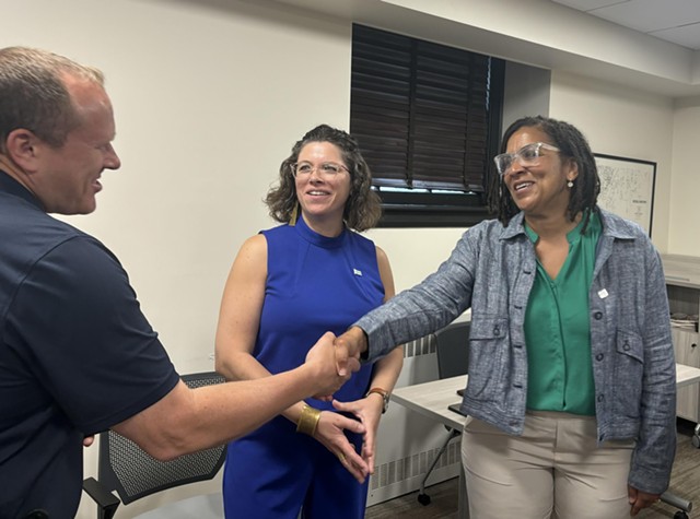 Jessica Brown shaking hands with Police Chief Jon Murad as Mayor Emma Mulvaney-Stanak looks on - JACK MCGUIRE ©️ SEVEN DAYS