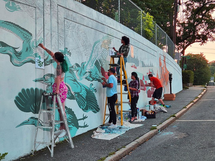 Artists Caroline Stjarnborg (far left) and Calvin Laituri (to her right) directing volunteers at the High Street Mural in Brattleboro - COURTESY OF EPSILON SPIRES