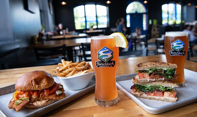 From left: Chicken Schnitzel Sandy, fries, E-Z Betty Spaghett, BLT and Switchback Ale at Switchback Brewing's Beer Garden & Tap House - DARIA BISHOP