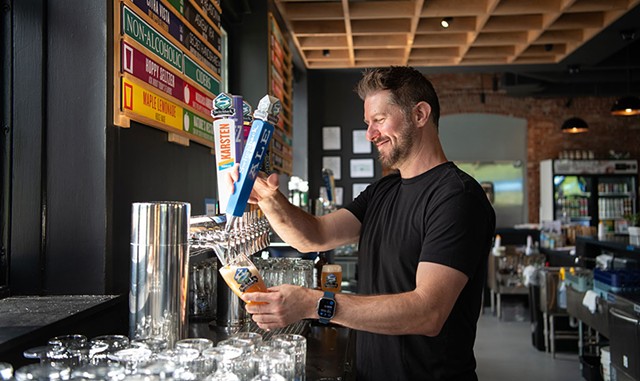 Josh Weber pouring a Switchback Ale - DARIA BISHOP