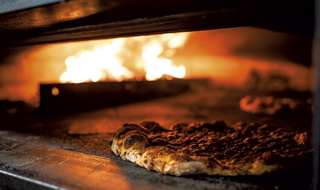 Pizza in the oven at Myer's Wood Fired - LUKE AWTRY