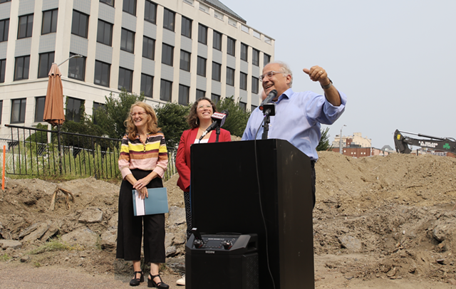 Champlain Housing Trust CEO Michael Monte (right) with Evernorth president Nancy Owens and Burlington Mayor Emma Mulvaney-Stanak