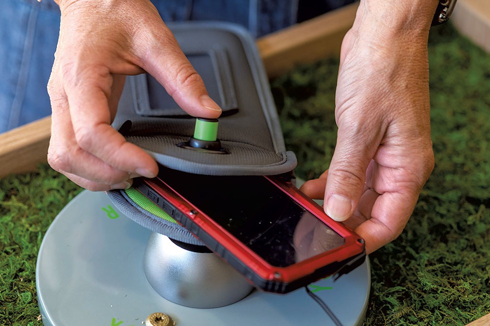 Unlocking a cellphone pouch with the Yondr system at Harwood Union Middle and High School in Duxbury - JEB WALLACE-BRODEUR