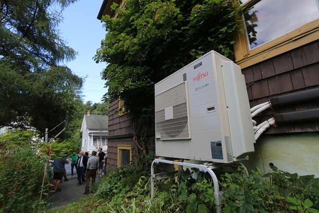 People touring a home in Montpelier with electric heat pumps - KEVIN MCCALLUM ©️ SEVEN DAYS