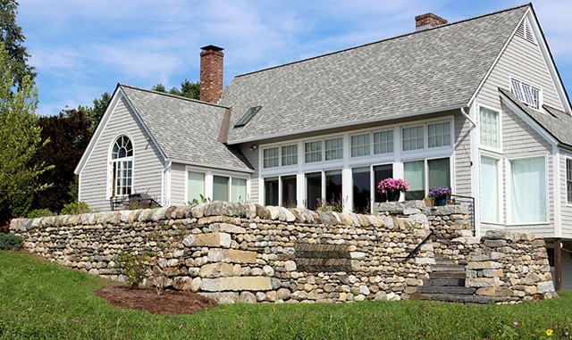 A dry stone retaining wall and patio steps in Rockingham, with stonework by Brian Post - COURTESY