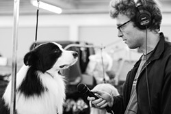 Chris Hoff interviewing a dog - ALYSSA KAPNIK SAMUEL