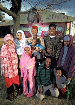 Aden Haji (back row, red cap) with his family - MATTHEW THORSEN