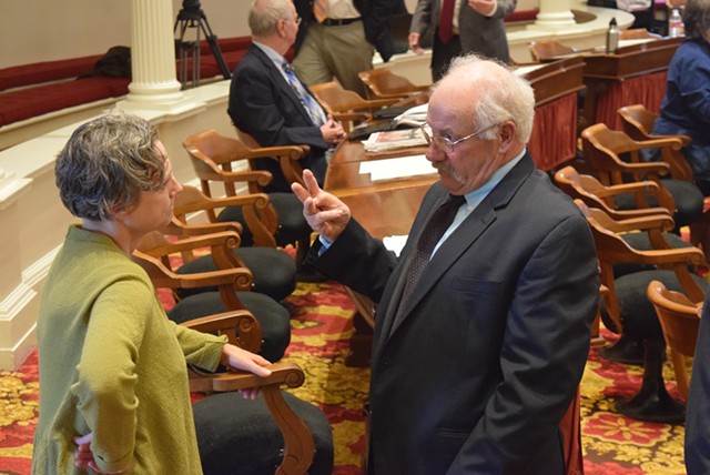 Rep. Bob Helm talks with Vermont State Colleges lobbyist Tricia Coates. - TERRI HALLENBECK