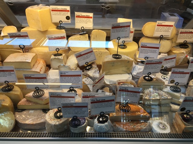 Cheese case at Mad River Taste Place - SALLY POLLAK