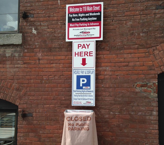 Parking sign at 110 Main Street - KEN PICARD