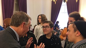 Gov. Phil Scott speaking with Alex Escaja-Heiss of South Burlington and Nathan DeGroot of Worcester