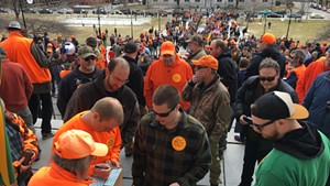 Gun-rights supporters making donations to the Federation of Vermont Sportsmen's Club for a lawsuit against S.55 while others wait in long lines to receive free 30-round magazines.