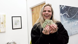 Maggie Kniffin and with her winnings from “The Art Show IV”