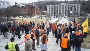 Citizens opposed to the new gun legislation gather at the Statehouse before last Wednesday's ceremony.