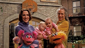 Annie Evans and Martin P. Robinson with their twins and Muppets