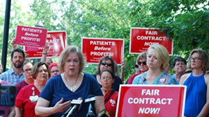 Nurses' union president Laurie Aunchman, right, and negotiator Julie MacMillan speaking to reporters