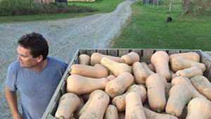 Eric Rozendaal with his butternut squash at Rockville Market Farm in Starksboro