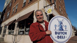 Chris West with the new Dutch Deli sign