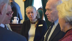 Sen. Alice Nitka, center, meeting with colleagues