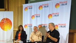 From left, GlobalFoundries executives Janette Bombardier, Mike Cadigan and Brian Harrison speak at a press conference at their Essex plant.