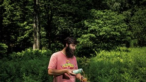 Christophe Gagn&eacute; pouring a glass of Windham Flora while standing in the wilderness behind Hermit Thrush Cellars