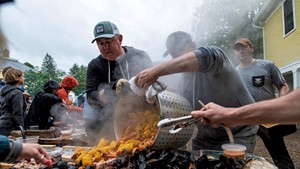 Eric Warnstedt (left) and Will McNeill (center) serving a high-country shrimp boil at 18 Elm