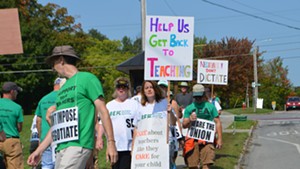 Burlington teachers picketing in front of Burlington High School in 2017