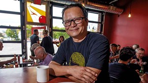 Owner Jake Tran with a pork carnitas omelette at the Firebird Caf&eacute;