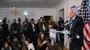 Sen. Bernie Sanders addressing reporters at his campaign headquarters in Burlington
