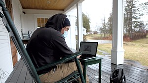 Mitch Hunt using the Wi-Fi outside of the Craftsbury library
