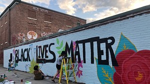 Arts So Wonderful muralists at work in downtown Burlington