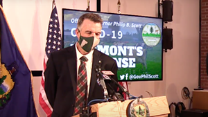 Gov. Phil Scott wearing a mask at Friday's press conference