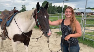 Lakenna Loura-Bumps, a trainer at Gonyaw Farm and Koen, a trail horse