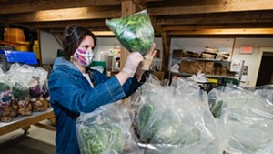 Andrea Solazzo, Vermont Foodbank agriculture and community outreach manager, packs produce for food shelf delivery