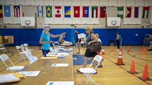 Voters and poll workers at Edmunds Middle School in Burlington