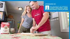 Rob Bousquet and his wife Brooke roll out some pizza dough