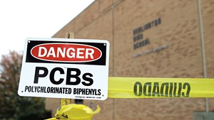 Signs warning about PCBs at Burlington High School