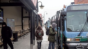 CCTA riders board buses on Cherry Street in Burlington.