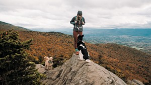 Maura Wieler with her two dogs atop Stowe Pinnacle