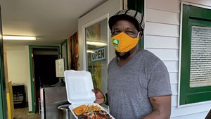 Bilon "Richie" Bailey with takeout from Jamaican Supreme