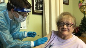 Helen Porter Rehabilitation and Nursing resident Elsie Johnson gets vaccinated on Monday.