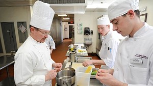 Chef-instructor David Parson and students Jackson Person, right, and Aidan Murch in a Sensory Analysis class in 2014