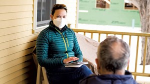 Samantha Ford speaking with Steve Goldstein at his home in Shelburne