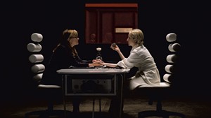 HEAD TRIP Riseborough (right) and Leigh discuss brain-hacking assassination techniques in Cronenberg's sci-fi film.
