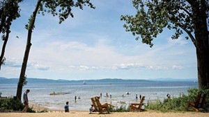 The Burlington Surf Club beach, with a view of Lake Champlain and &#10;the Adirondacks