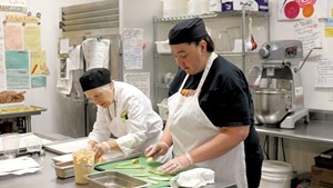 Chef-instructor Robin Burnett (left) and participant Stacey Clarke in the Vermont Works for Women Fresh Food Enterprise training program in 2015