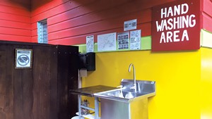 Vermont-created posters at one of the field station's handwashing areas