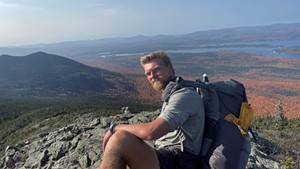Brandon Weis atop a mountain in Maine