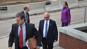 Defense attorney Brooks McArthur and Sen. Norm McAllister arrive at court Monday in St. Albans.