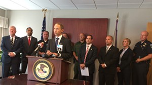 U.S. Attorney Eric Miller is joined by local and federal law enforcement officials during a press conference in Burlington.